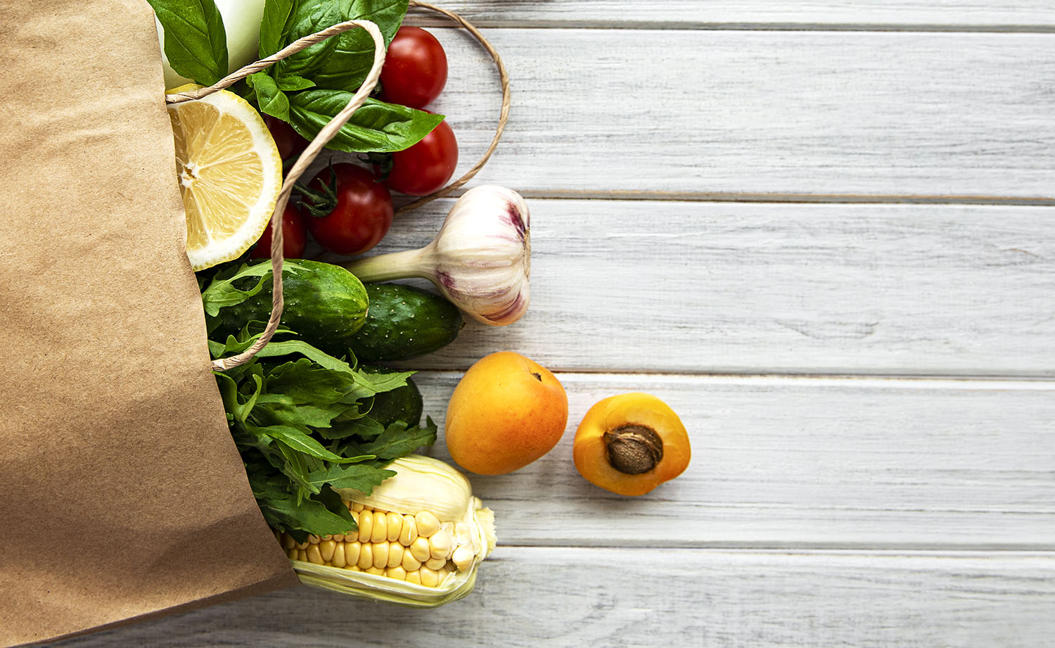Healthy food background. Healthy  food in paper bag, vegetables and fruits.  Shopping food supermarket and clean vegan eating concept.